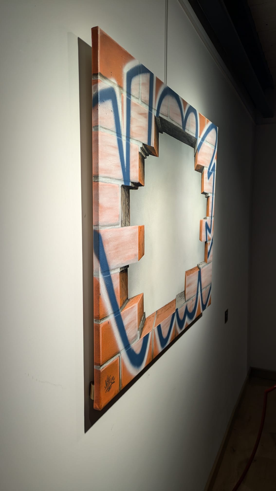 Mémoire de mur de Vile — graffiti, briques et jeu de vide dans le mur